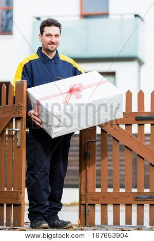 Postman delivering packet wrapped as present
