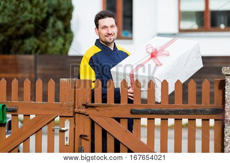 Postman delivering packet wrapped as present