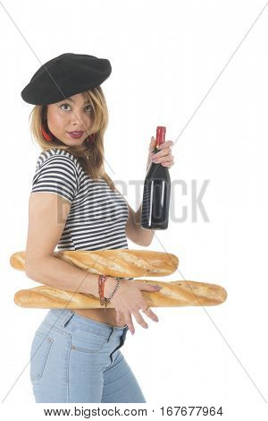 Young French girl with typical French barret and striped shirt bread and a bottle of wine isolated over white background