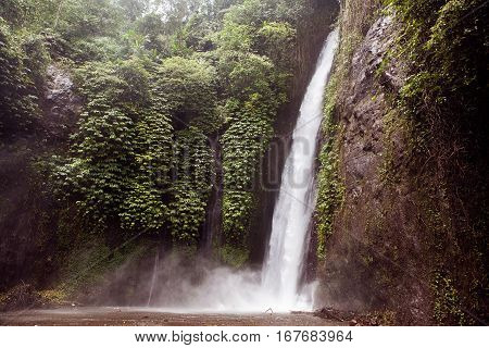 Munduk waterfall in jungle in Bali island, Indonesia