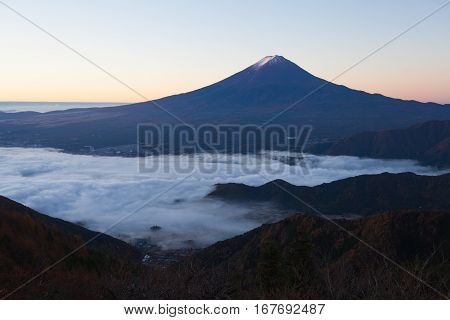 Mountain Fuji and sea of mist above Kawaguchiko lake in morning autumn season