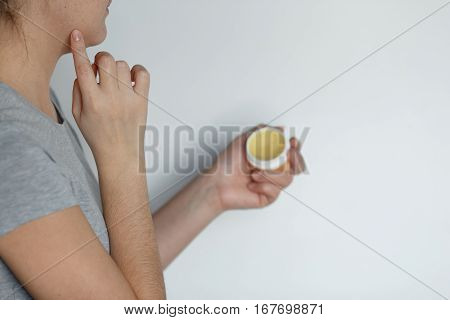 Female Applying Balm Moisturizing Balsam.