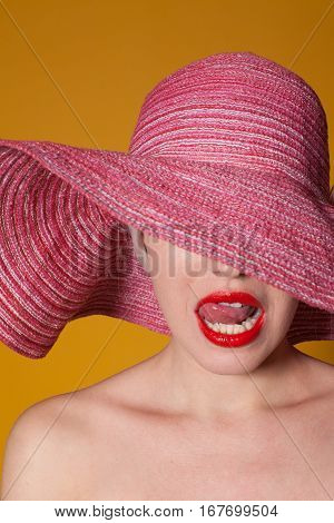 woman with a hat tonque red lips 1
