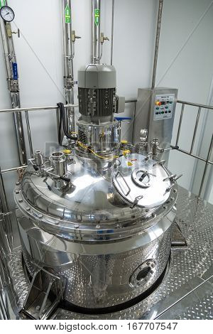 big steel chromed compressor tank in pharmaciutical factory