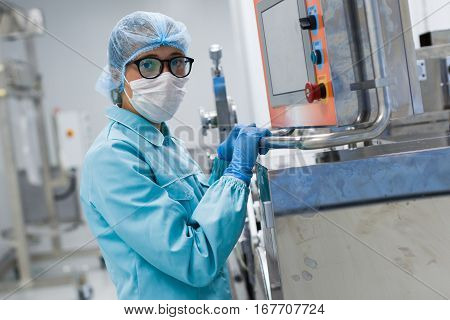 Blured Background Picture, Cute Facroty Worker Near Control Panel