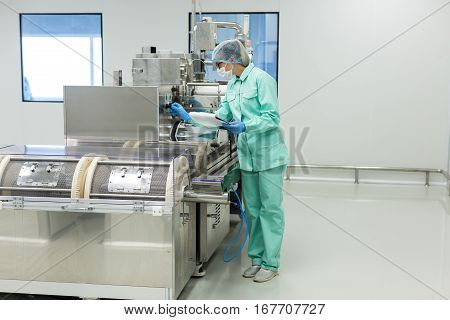 Factory Worker Sets Machine