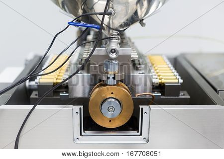 close picture of engine of machine in factory