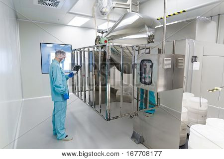 Medical Worker Is Checking The Readings Of Control Panel