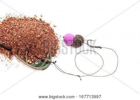 Dry Feed For Carp Fishing. Ready For Use Carp Bait With Fishing Flat Feeder For Carp Fishing Isolate