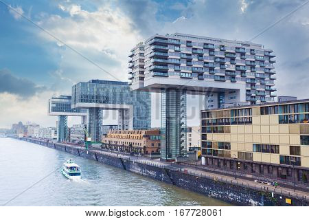 Modern business center on blue sky background in Cologne, Germany. Cologne Kranhaus - modern complex of buildings on the bank of Rhine with beautiful panoramic views in blue tones.