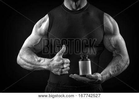 Handsome Sexy Athlete Man With Muscular Body Holds Steroid Jar