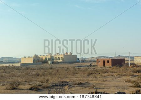 Egyptian houses in desert like small village far away