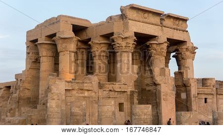 Ruins of an ancient temple of Egypt with statues and columns