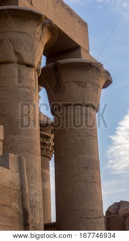Ruins of an ancient temple of Egypt with statues and columns