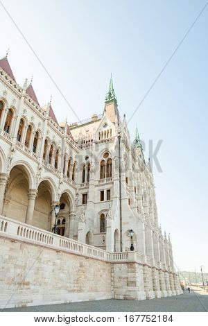 Building Of Hungarian National Parliament Viewed From The Side Of The Dunabe River In Budapest, Hung