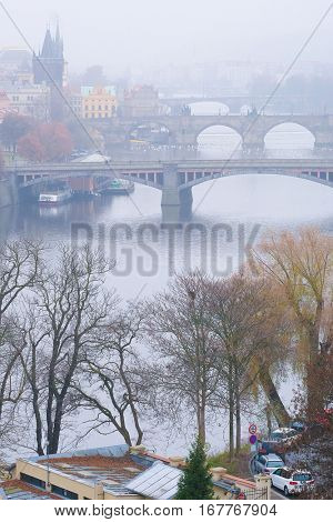 Panorama of an old Prague, bridges and embankment of Vitava river, Czechia