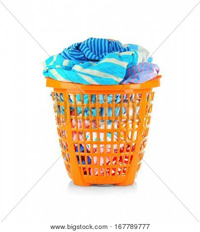 Clothes in  basket on white background