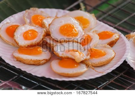 Fried quail egg or partridge egg friedThai street food