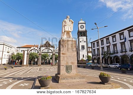 Main square of Ponta Delgada with statue of Goncalo Velho Cabral in Azores. Portas da Cidade Gates and Saint Sebastian church with clock tower located there.
