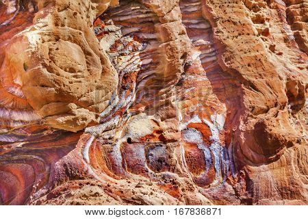 Red Rock Abstract Petra Jordan Built by the Nabataens in 200 BC to 400 AD. Rose Red canyon walls create many abstracts close up. Reds are created by magnesium in sandstone.