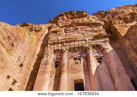 Royal Rock Tomb Arch Petra Jordan. Built by the Nabataens in 200 BC to 400 AD. Inside the Tombs the red orange white blue of the ceilings and arches create coloful designs and absctracts