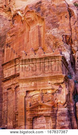 Rose Red Yellow Rock Tomb Street of Facades Petra Jordan. Built by the Nabataens in 200 BC to 400 AD. Rose Red canyon walls create many abstracts close up. Inside the Tombs the rose red can become blood red. Reds are created by magnesium in sandstone.