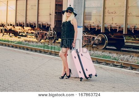 beautiful girl at raiway station. uses communication