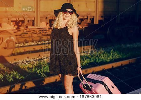 beautiful girl at raiway station. uses communication