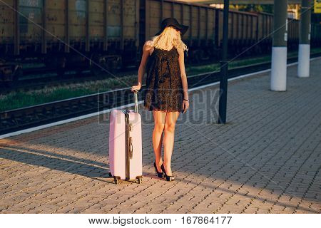 beautiful girl at raiway station. uses communication