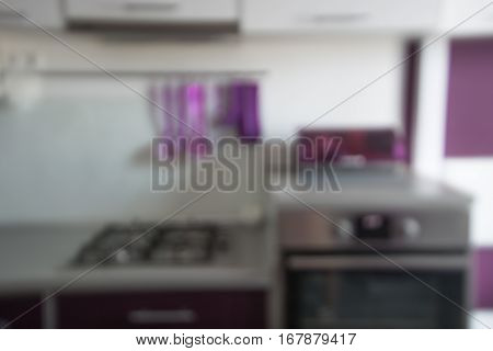 Blurred background. Modern kitchen with tabletop and space for you.