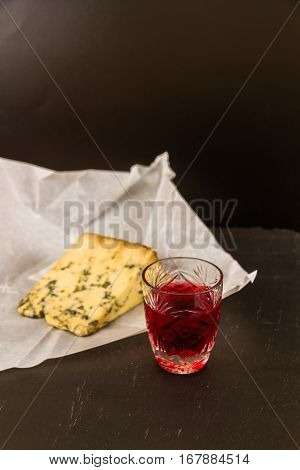 Glass Of Sloe Gin With Stilton Cheese