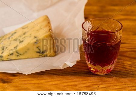 Glass Of Sloe Gin With Stilton Cheese