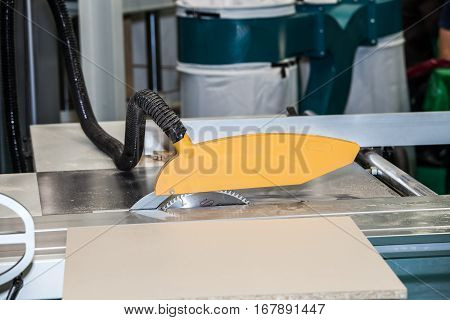 Woodworking machine in action. Timber cutting machine. Wood processing equipment