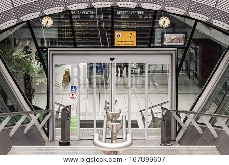 BRUSSELS BELGIUM - AUGUST 21 2014: Looking down from the top of stairs going down to Gare de Bruxelles-Luxembourg train station at the Espace Leopold (Leopold Square) under the Esplanade of the European Parliament