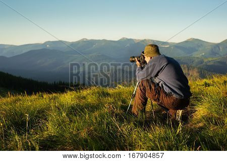 The photographer with camera on a tripod.
