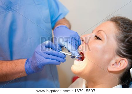 Dentst checking cental hygiene, toned image, white
