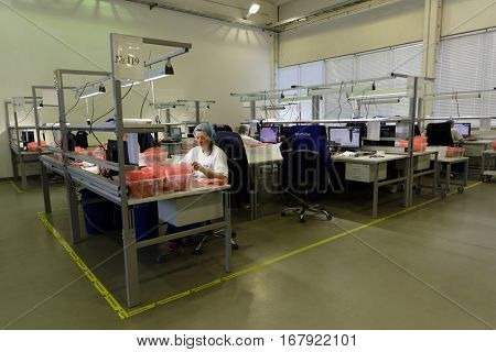 ST. PETERSBURG, RUSSIA - NOVEMBER 2, 2016: People at work on the production site of StarLine company. It is one of the leading company on the automotive security market of Russia