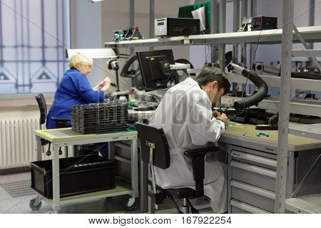 ST. PETERSBURG, RUSSIA - NOVEMBER 2, 2016: People at work on the production site of StarLine company. It is one of the leading company on the automotive security market of Russia