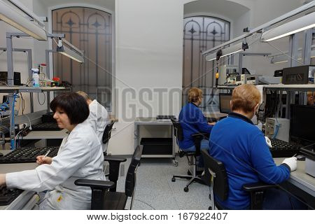 ST. PETERSBURG, RUSSIA - NOVEMBER 2, 2016: People at work in the testing laboratory of StarLine company. It is one of the leading company on the automotive security market of Russia