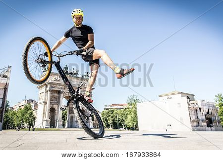 Young athlete making tricks on his bicycle