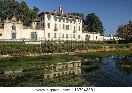 Cassinetta di Lugagnano (Milan Lombardy Italy): facade of the historic Villa Visconti Maineri along the canal known as Naviglio Grande of Turbigo