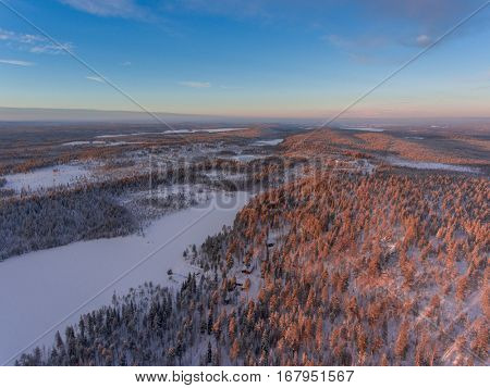 Aerial view of winter snowscape and forest