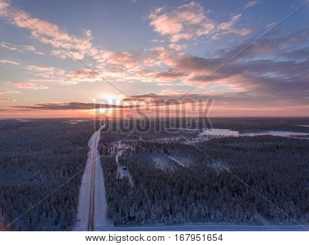 Aerial view of winter snowscape and forest