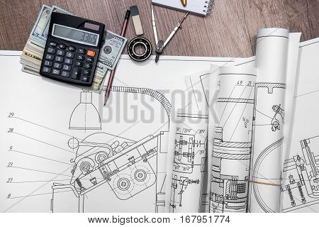 The drawing machine pencil ruler us dollar and compasses