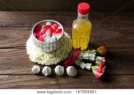 Water in bowl mixed with perfume and flowers corolla for Songkran festival in Thailand.