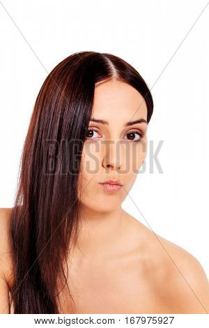 Attractive topless woman blowing a kiss