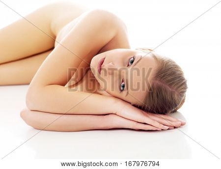 Nude woman lying on the floor