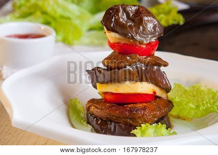 Vegan Dish - Seitan With The Eggplant On White Plate