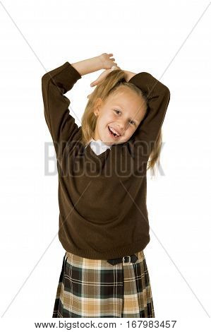 young beautiful happy schoolgirl in pigtails and uniform smiling happy and excited having fun isolated on white background in school girl education success and self confidence