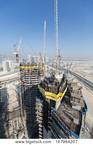 United Arab Emirates, Dubai, 05/21/2015, Damac Towers Dubai by Paramount, construction and building ariel views with cityscape background